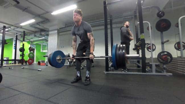 At the gym lifting heavy weights